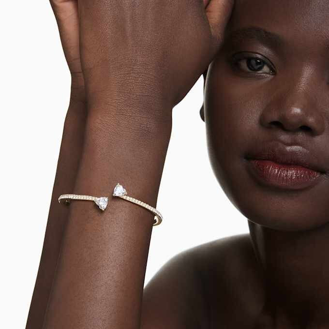 Bracciale rigido Mesmera a forma di cuore, bianco, placcato oro Bracciale rigido Mesmera a forma di cuore, bianco, placcato oro